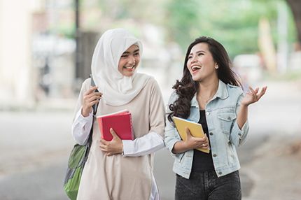 Female students walking together socialising